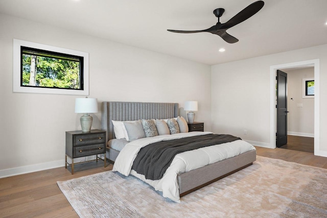 bedroom featuring hardwood / wood-style flooring and ceiling fan