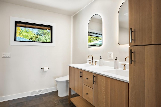 bathroom with hardwood / wood-style flooring, vanity, and toilet