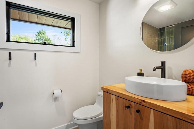 2291 Williams Point Dr, Stoughton, WI 53589 - bathroom with toilet, vanity, and baseboards