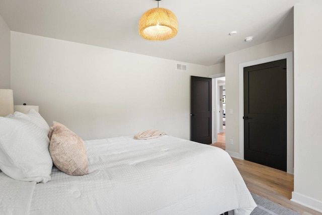 bedroom featuring hardwood / wood-style flooring