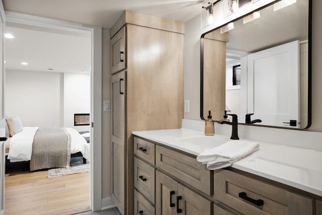 bathroom with vanity and wood-type flooring