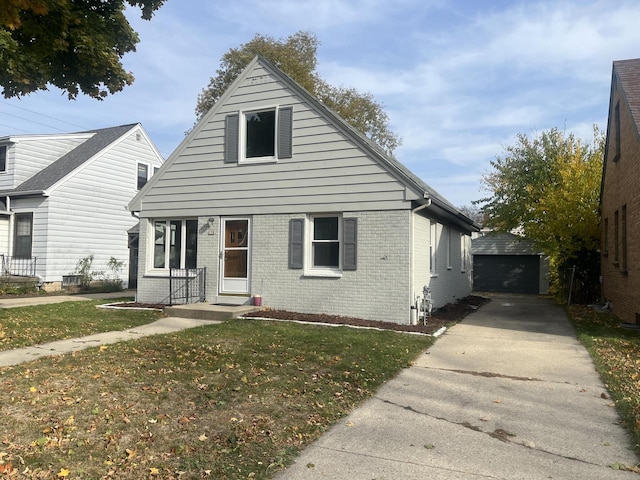 view of front of house featuring an outbuilding, a garage, and a front yard