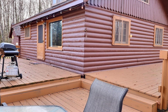 wooden deck with grilling area