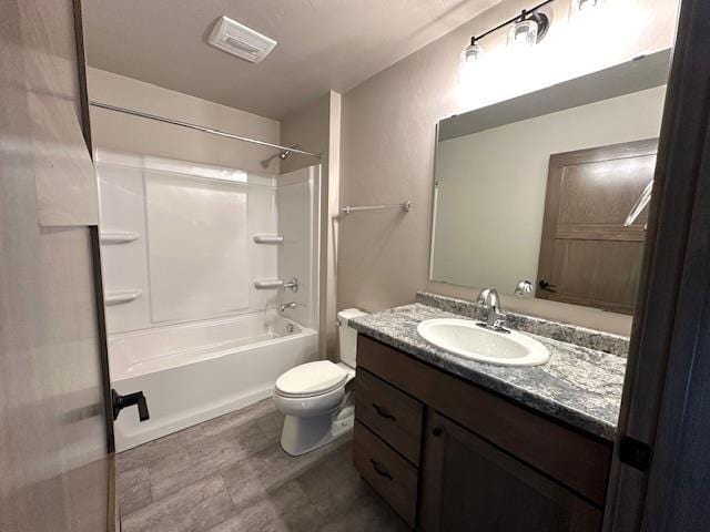 full bath with vanity,  shower combination, toilet, and visible vents