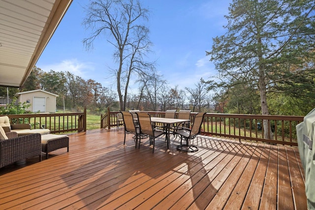 wooden terrace with a storage shed