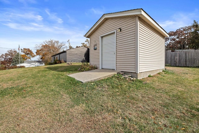 view of outbuilding with a lawn