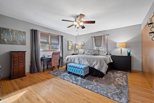 bedroom featuring hardwood / wood-style floors and ceiling fan