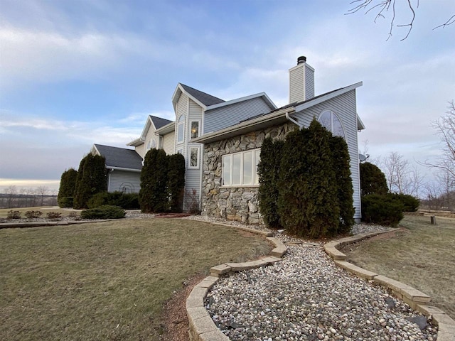 view of property exterior featuring a yard