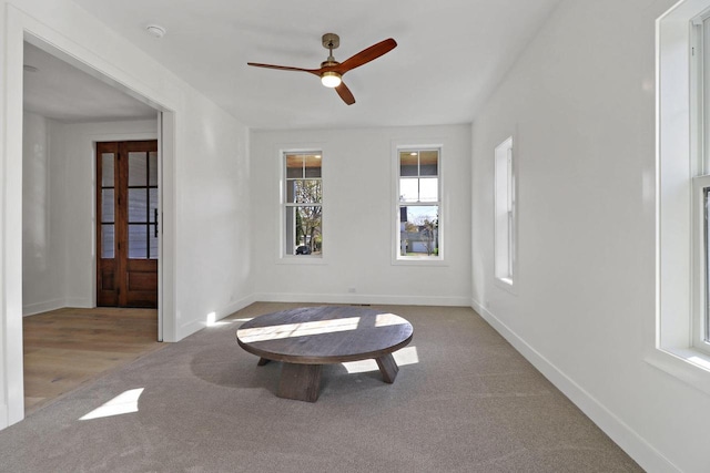 sitting room featuring light hardwood / wood-style flooring and ceiling fan