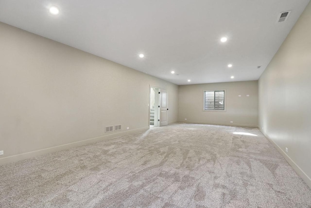 empty room featuring light carpet