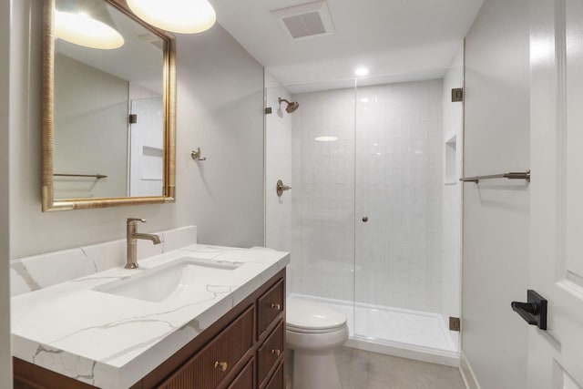 bathroom with vanity, toilet, and walk in shower