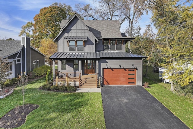 modern farmhouse style home with a porch, a front lawn, and a garage