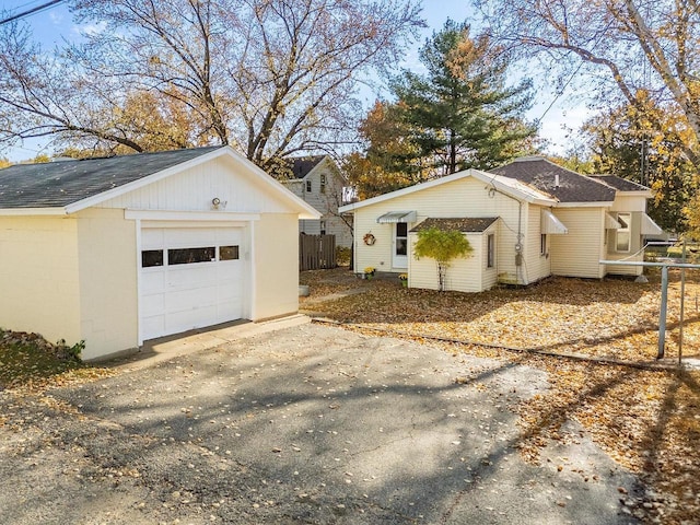 view of side of home featuring a garage