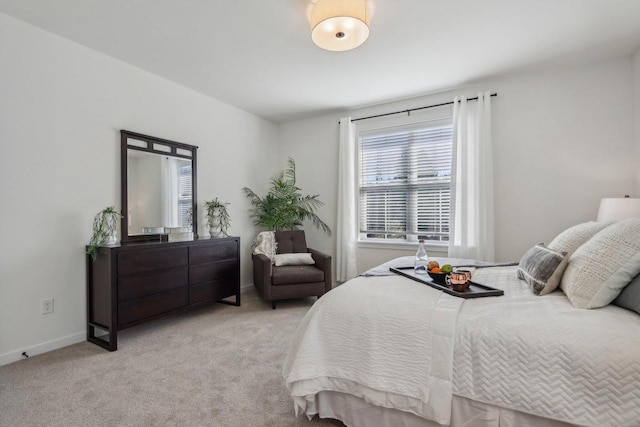 bedroom with light carpet