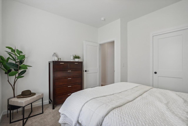 bedroom with light colored carpet