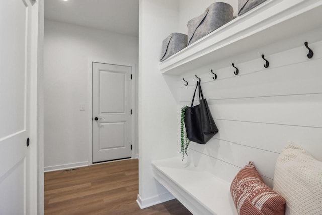 mudroom with wood-type flooring