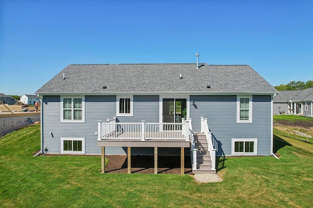 back of house featuring a yard and a deck