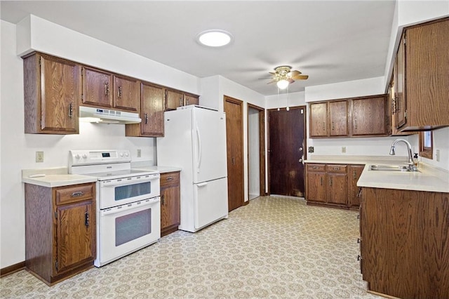 kitchen featuring sink, white appliances, and ceiling fan