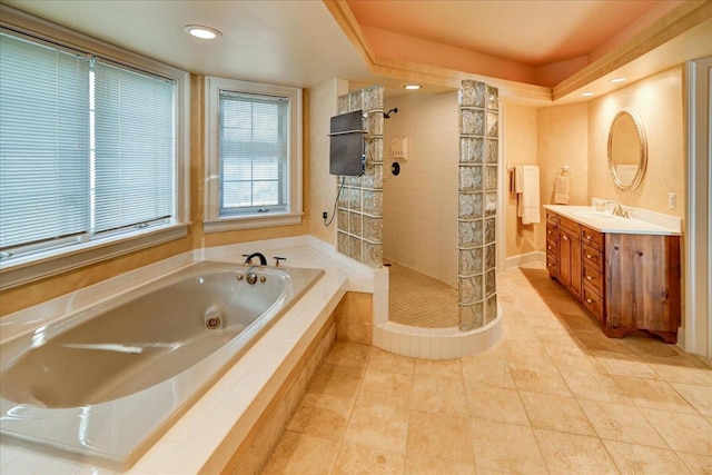 bathroom with vanity, shower with separate bathtub, and tile patterned floors