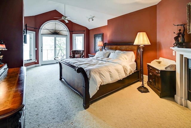 bedroom featuring carpet flooring, lofted ceiling, and ceiling fan