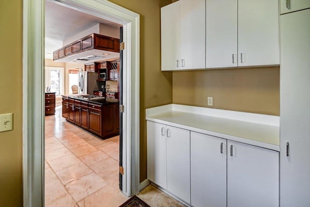 kitchen featuring white cabinetry and stainless steel appliances