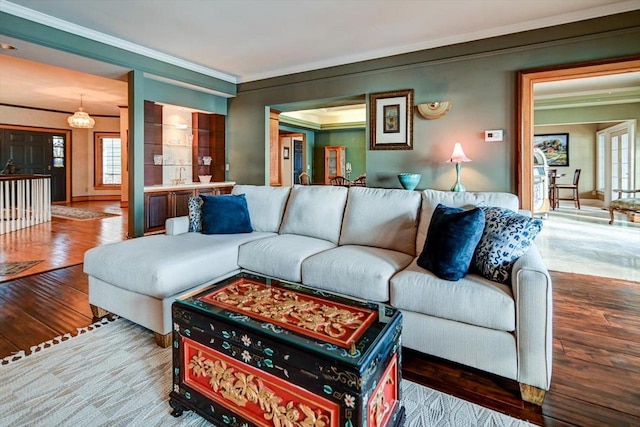 living room featuring ornamental molding and hardwood / wood-style flooring