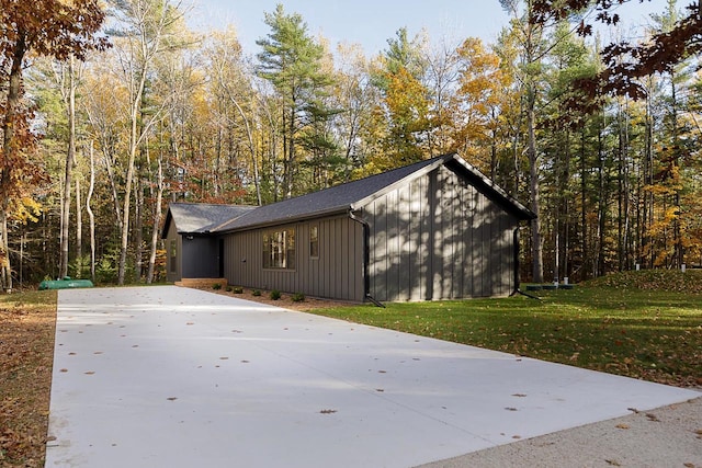 view of outbuilding featuring a yard