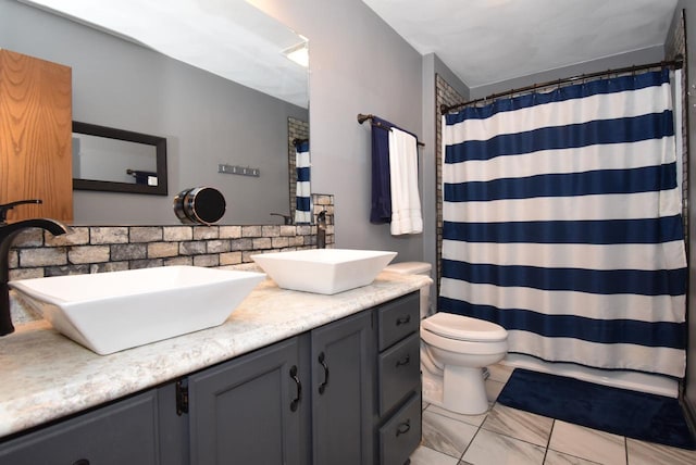 bathroom with vanity, toilet, and a shower with shower curtain