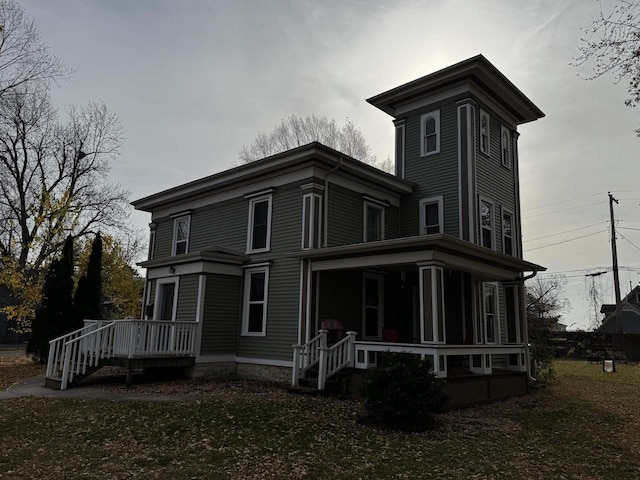 rear view of property featuring a sunroom