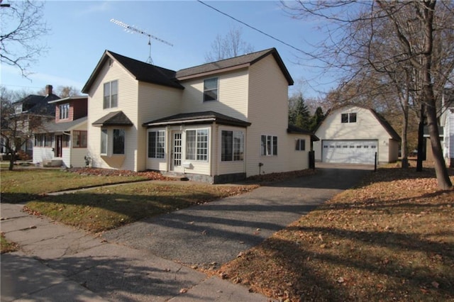 view of side of home featuring an outdoor structure and a garage