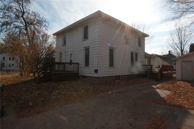 view of side of home featuring a wooden deck