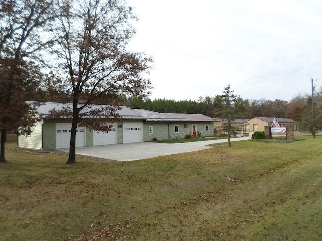 ranch-style home with a front yard and a garage