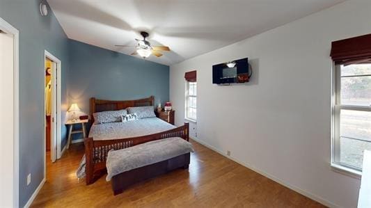 bedroom featuring hardwood / wood-style floors and ceiling fan