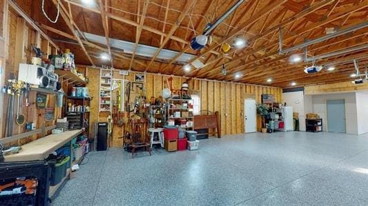 garage featuring a workshop area and a garage door opener