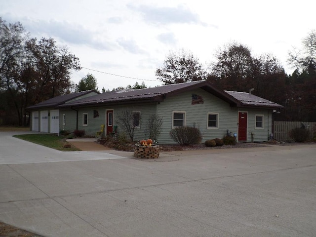 single story home featuring a garage