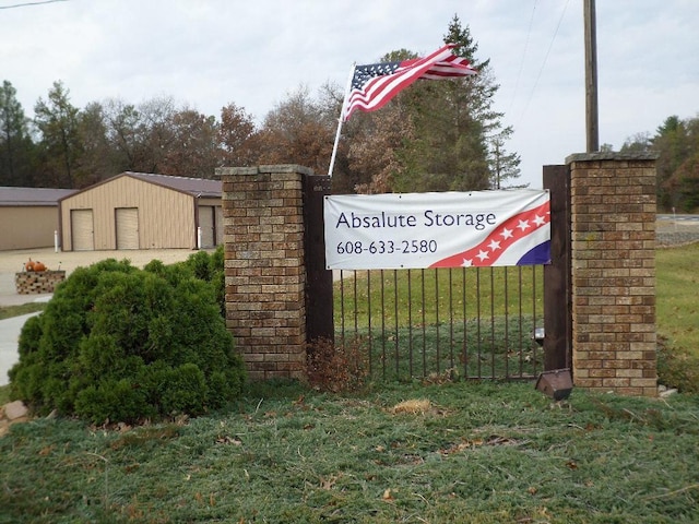 community sign featuring a lawn