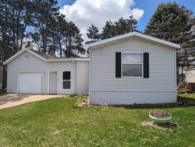 view of front of house with a front lawn and a garage