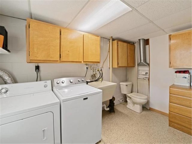 clothes washing area with washing machine and clothes dryer