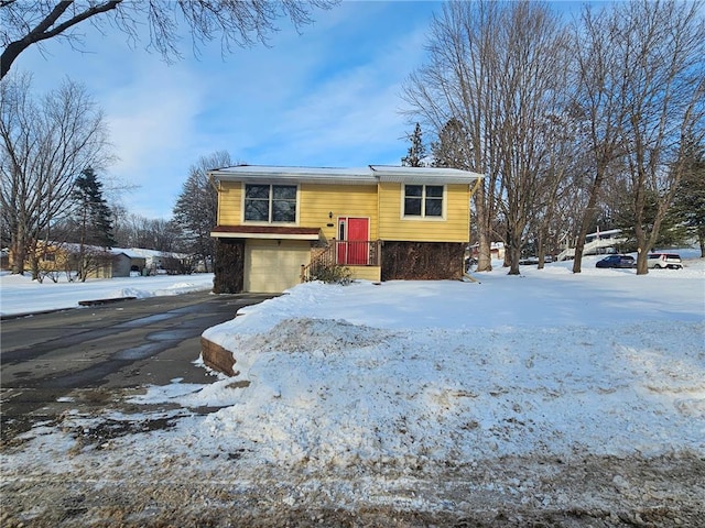 split foyer home featuring a garage