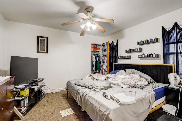 bedroom featuring ceiling fan, a closet, and carpet