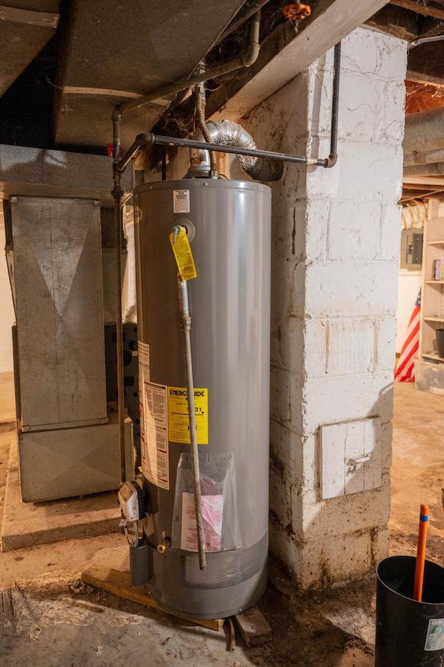 utility room featuring gas water heater