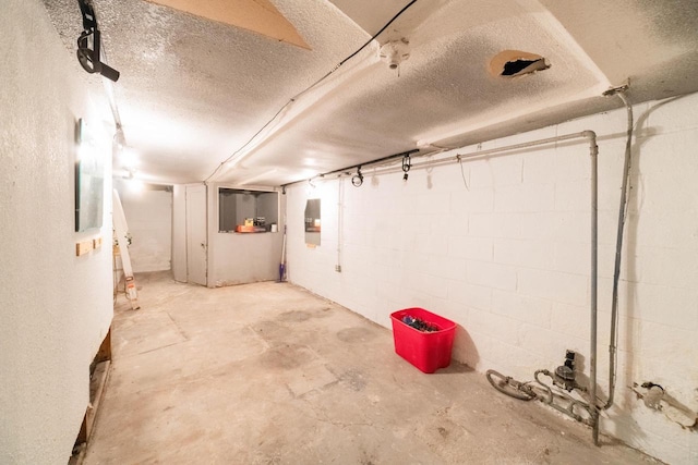 basement with a textured ceiling