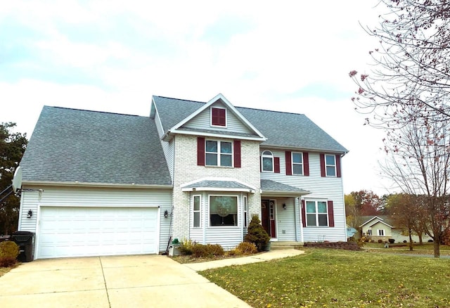 view of front of home with a garage and a front yard