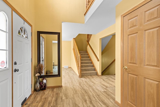 entryway with light hardwood / wood-style floors