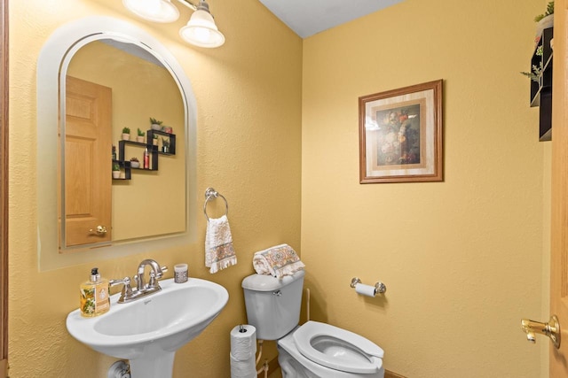 bathroom with sink and toilet