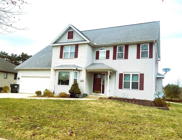 view of front facade with a front lawn and a garage