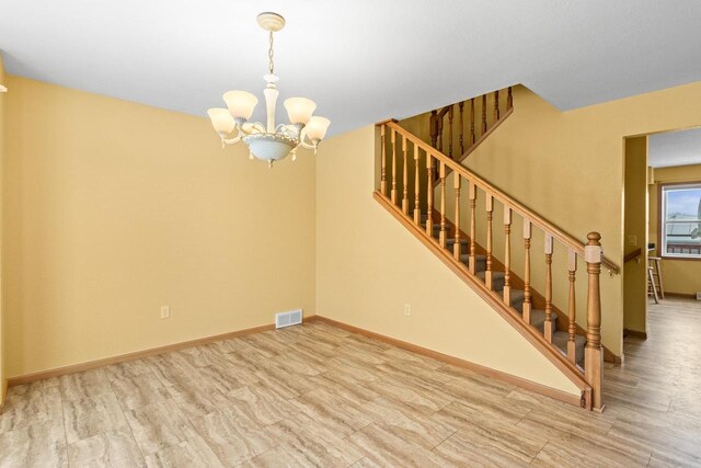 interior space with a chandelier and light wood-type flooring