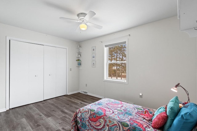 bedroom with ceiling fan, a closet, and dark hardwood / wood-style floors