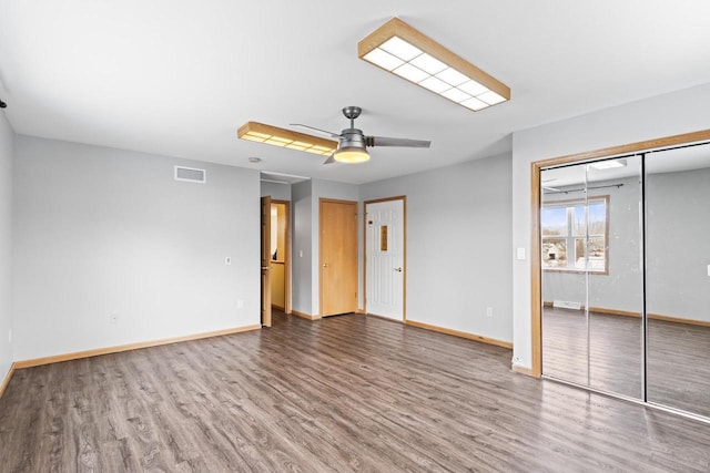 unfurnished bedroom featuring ceiling fan and wood-type flooring