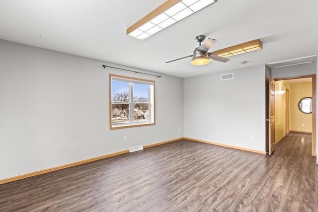 empty room with hardwood / wood-style flooring and ceiling fan